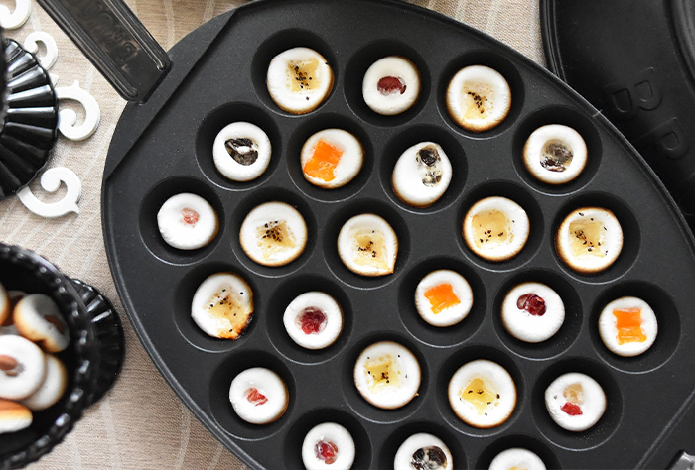 Dried fruit and cheese marshmallow cookies made on the BRUNO Oval Hot Plate takoyaki plate
