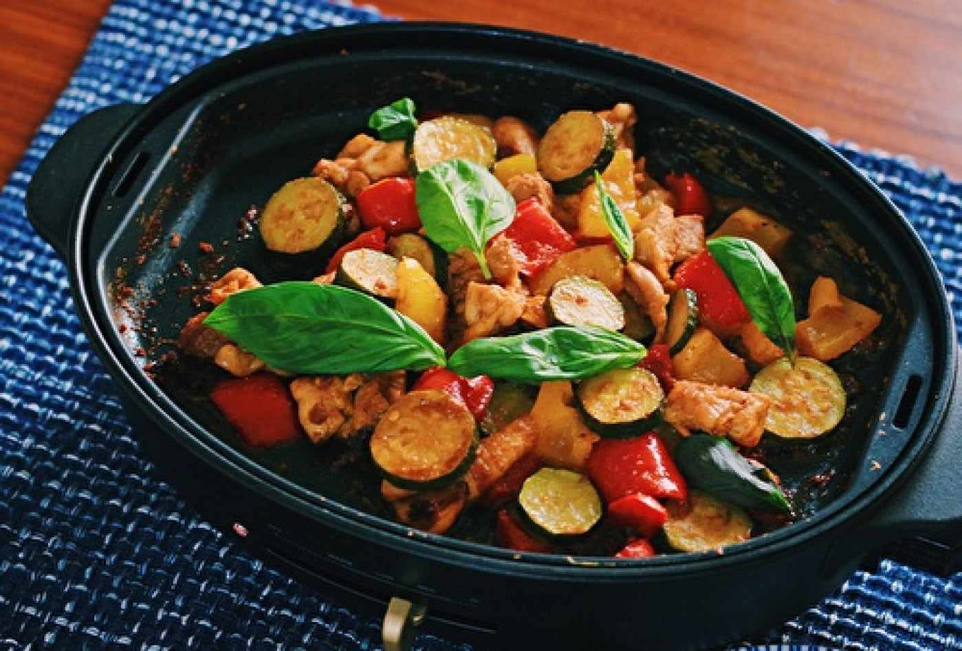 Summer vegetable tandoori chicken cooked on the BRUNO Oval Hot Plate