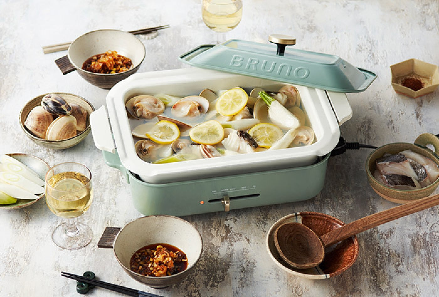 Japanese sake steamed clams with salted lemon, cooked on the BRUNO Compact Hot Plate